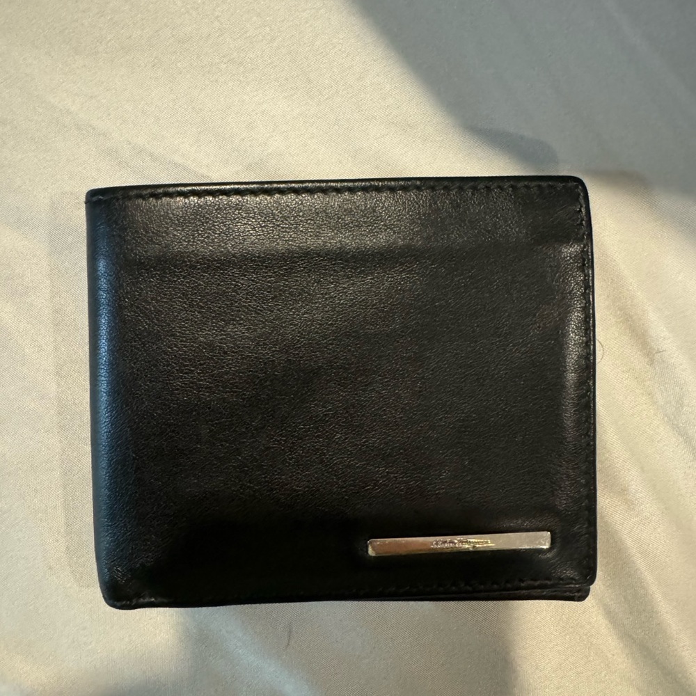 Lightly used black Salvatore Ferragamo men’s wallet.
